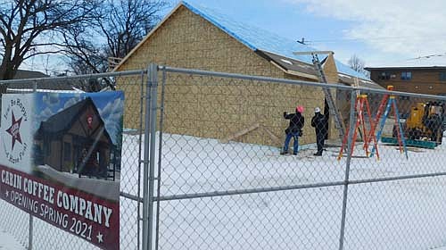 Workers from Kreofsky Building Systems of Plainview continue to make progress on the construction of the new Cabin Coffee building, scheduled to open along Stewartville's Main Street this June. Last week, Kreofsky employees finished putting up the structure's walls and roof.