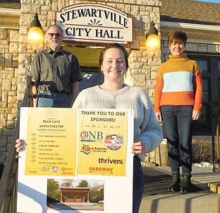 Lexi Williams of Community Economic Development Associates (CEDA), foreground, worked with members of the Stewartville Area Community Foundation, including Al Chihak, left, and Lisa Lonien, right, to schedule a series of Wednesday evening summer concerts at the new Bear Cave Amphitheater beginning on June 16. Aaron Simmons, a Stewartville native and an accomplished singer-songwriter, heads the list of performers.