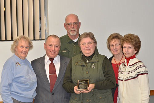 Mayor Jimmie-John King, second from left, presented the Mayor's Award for Community Service to the Stewartville Area Historical Society at the city's annual awards event at the Civic Center on Dec. 16, 2015. Society Board of Trustees members who attended the event included, from left, Elaine Eggler, Buck Fredricksen, treasurer; Vicki Meredith, president; Ardis Copple, and Myrna Wesselman, historian.
