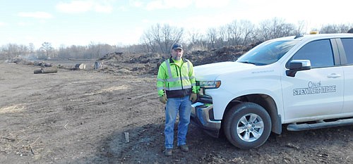 Sean Hale, public works director for the city of Stewartville, stands at the city's brush dump last week. Commercial haulers, who will now pay fees for dropping off items at the dump, must register assisted/power dump trailers and trucks at City Hall or by emailing TREE@stewartvillemn.com.