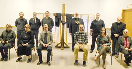 Church leaders gathered for the annual ecumenical Good Friday service at the Stewartville Civic Center on Friday, April 2. The 12 participants, who each read from the Passion of Jesus according to John, include, front row, from left, Bridget Sheely, Racine and Sumner Center United Methodist churches; Laura Nordstrom, Stewartville United Methodist Church; Byron Meline, Zion Lutheran Church; Aaron Regnier, Grace Evangelical Free Church; Kim Kyllo, Zion Lutheran Church; and Becky Hoot, Stewartville Christian Church. Back row, from left, Chad Skaran, Redemption Hill Church; John Grams, Grace Evangelical Free Church; Lance Lorenz, Pleasant Grove Church of Christ; Father Kevin Connolly, St. Bernard's and St. Bridget's Catholic churches; Andrew Langseth, Grace Evangelical Free Church; and Dave Hoot, Stewartville Christian Church. Laurie Helmers provided the music and singing for the service.