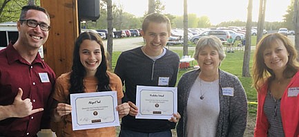 Stewartville High School graduating seniors Abby Teal, second from left, and Nick Vetsch, center, both received a $500 college scholarship from the Stewartville Area Chamber of Commerce at the Chamber's Senior Appreciation Banquet on Wednesday evening, May 12. Chamber members and staff who presented the scholarships include, from left, Jared Johnson of Halcon, Chamber president; Myrna Welter, membership coordinator; and Megan Romens of Mary Kay Cosmetics, vice president.