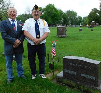 Mayor Jimmie-John King, left, will be a featured speaker at the annual Memorial Day ceremony at Woodlawn Cemetery on Monday morning, May 31. Roger Peterson, outgoing commander of the Stewartville American Legion Post 164 and an active member of the Stewartville Prescher-Kumm Veterans of Foreign Wars (VFW) Post 8980, will be the master of ceremonies for the event to honor U.S. veterans who have served their country, especially those who have paid the ultimate price for freedom. The gravestone is for Harold "Harry" Prescher, for whom the Stewartville VFW is named. On the opposite side, the gravestone is inscribed, "In Loving Memory of Our Son, Harold "Harry" Prescher, 1920-1942. World War II, U.S. Navy, USS Houston."