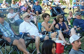 The Smokin' Coyotes, a country and classic rock group, opened the Bear Cave Amphitheater Summer Concert Series with a performance at the new amphitheater on Wednesday June 16 from 6:30 p.m. to 8:30 p.m. Here, a large audience appreciated the group's music.
