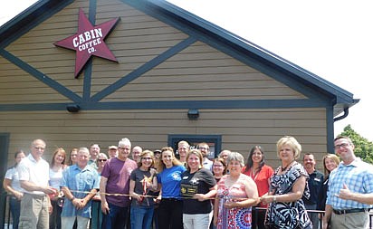 The Stewartville Area Chamber of Commerce welcomed Cabin Coffee as a new Chamber member with a ribbon-cutting ceremony at the new business on Thursday, June 17, four days before the Cabin's official opening on Monday, June 21. Cabin Coffee owners who cut the ribbon include, beginning third from left in front, from left, Kevin and Robin Splittstoesser, Leigh Dzubay and Hannah Lechner. Others in front, from far left, are Al Chihak of Mystic Moon Antiques & Collectibles, Mayor Jimmie-John King, Myrna Welter, Chamber membership coordinator; Ann Lutteke of ONB Bank and Jared Johnson of Halcon.