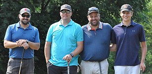 The overall champions of the 18-team Stewartville Golf Booster Club "four-person best shot" tournament on July 3 was the team of, from left, Jeremy Ferrie, Trevor Wiles, and Todd and Nick Lechtenberg.