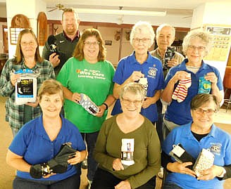 Members of the Stewartville Kiwanis Club urging local and area residents to donate new pairs of socks at Bremer Bank beginning Nov. 1 include, front row, from left, Rita Oswald, Mary Brouillard and Glynis Sturm. Second row, from left, Barb Howes, Lori Torgerson, Diane Bergland and Carol Youdas, chairperson of the campaign. Back row, from left, Nick Hale and Don Brouillard.