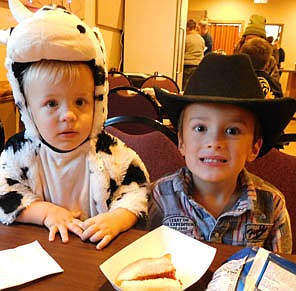 Brecken Herrick, 1, left, wore a cow costume and his brother Tucker, 4,was a cowboy at the Hall-O-Weenie kids party on Sunday, Oct. 31. Kids who attended enjoyed hot dogs, chips, a drink and a treat bag. Tucker is a preschooler at the Central Education Center.