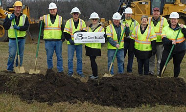 City of Stewartville officials and associates broke ground last week for the new Bear Cave Estates, to include 18 townhomes and 12 single patio homes along County Road 35 west of 11th Avenue and south of Al and Peggy Chihak's current homestead. From left are Jerry Brehm of Edge Construction, Bill Anderson of Short Elliott Hendrickson (SEH), the engineer for the project; Al and Peggy Chihak, developers; Mayor Jimmie-John King, Sean Hale, city public works director; Cheryl Roeder, city clerk; Bill Schimmel Jr., city administrator; and Jenna Obernolte, an engineer for SEH, the city's engineering firm. The Chihaks thanked the city and SEH for their help with the project. Roeder has estimated the homes will be ready for purchase by mid-June of 2022.
