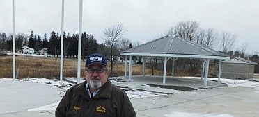 Roger Peterson, commander of the Stewartville Veterans of Foreign Wars (VFW) Post 8980 for six years, stands near the restroom and octagon picnic shelter that will be part of the VFW's Veterans Memorial Park near Stewartville's south entrance. "We're doing this to thank our veterans for their serivce to our country," he said.