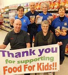 Robert Hruska, grocery manager of Fareway, seated at left, invites the store's shoppers to donate to the 18th annual Food for Kidz food-packaging event for the poor at Fareway from Monday, Jan. 31 through Saturday, Feb. 12. Stewartville Kiwanis Club Food for Kidz helpers include Mary Brouillard,co-chair, seated at right, and in back, from left, Glynis Sturm, Don Brouillard, Carol Youdas and Rita Oswald.