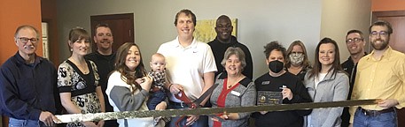 The Stewartville Area Chamber of Commerce welcomed 507 Family Chiropractic as a new Chamber member with a recent ribbon-cutting ceremony at the business's grand opening at 100 Second Street Southeast, Suite 2. From left are Al Chihak, R&C&#8200;Storage; Jessica Gilmour, chiropractic assistant; Josh Buckmeier, ONB Bank: Theresa Hosch, holding son&#8200;Kason; Dr. Kevin Hosch, DC, cutting the ribbon; Manasseh Kambaki, Hope Fuse; Myrna Welter, Chamber membership coordinator; Jessica Wampach, First Alliance Credit Union; Gwen Ravenhorst, Chamber administrator and Gwen's Confections; Megan Romens, Chamber president and Mary Kay sales director; Jared Johnson, HALCON; and Kevin Welter, Welter Entertainment, LLC and GEOTEK.
