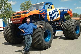 Matt Theye, owner of Stewartville NAPA Auto Parts stands, next to the NAPA Monster Truck that was in town last week promoting a Summer Sizzler Sale at the Stewartville NAPA store on July 10. Hundreds visited NAPA to see the enormous vehicle, enjoying great prices on store merchandise, free food and refreshments and door prizes all day. 