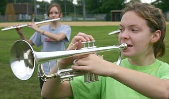 Members of the SHS marching band honed their skills at band camp including, Jessica Lucas, in foreground and Tom Rouchka, background. 