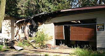 WAS IT ARSON? -- The State Fire Marshal and the Olmsted County Sheriff's Department are investigating a possible arson case at this home at 3331 68th St. Southeast in Simpson.  Anyone with information about the case may call the arson hotline at 1-800-723-2020. Rewards of up to $2,500 will be available for persons who provide information leading to the identification of those responsible for the fire, said Steve Wolf, Stewartville fire chief.                         