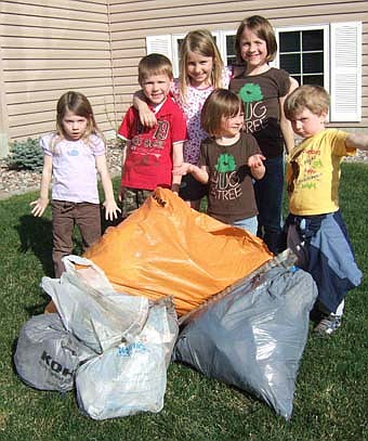 Completing their second annual Earth Day Walk and trash pickup on April 22 were Jes Johnston, Kristina Ramaker, their children, and a friend of the kids, Garret Norton. They picked up bags of trash as well as a full-size mattress, street sign with pole, a baby stroller, an old baby carriage, several slabs of wood, a frying pan, an iron post and a flower pot! The kids, ranging in age from 4-8 years old pictured above, are from left in back, Elise Ramaker, Mason Ramaker, Grace Ramaker, Emma Johnston (sort of front), Sofia Johnston and Garret Norton.  