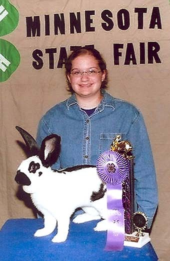 Stephanie Zylstra, with her Grand Champion ribbon at the Mnnesota State Fair. Stephanie received her ribbon with her large breed-checkered giant. She is a member of the Interstate Hi-Flyers 4-H Club.  