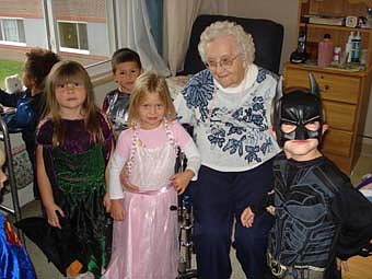The preschool 2 class from Endless Journey Child Care was invited to the Stewartville Care Center for a Halloween party on Thursday, Oct. 28.  The children played games and won prizes.  They also visited some of the residents in their rooms to show off their costumes.  Everyone had a fun and spooky time! Clara Wellik, a resident of the Stewartville Care Center, is pictured with kids from Endless Journey Child Care, Jayden James, Cora Sieler and Ethan Meyer.  