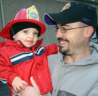 Jon Algyer of Rochester smiles at his 19-month-old son Conner, who enjoyed the SFD open house. 