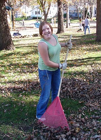 AUTUMN LEAVES -- Becky Guy and many other seventh-graders from Stewartville Middle School raked leaves at Florence Park as part of a community service project last Tuesday, Oct. 23. Seventh-graders also raked the park a year ago.  