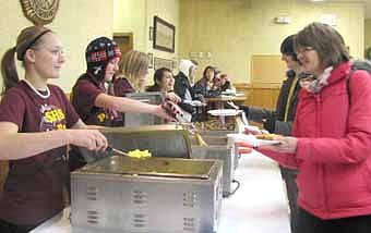 Stephanie Schmidt, at left in the foreground, prepares to serve scrambled eggs at the Stewartville High School Band's fund-raising French toast breakfast at the Stewartville American Legion Post 164 on Sunday, Jan. 22. Jessica Honsey, band director, said the band raised more than $1,000 from the breakfast. Other students who served food include, front to back, Cassidy McCartan, Kristina Westurn-Reed and Chrissy Dotterwick. The SHS Band will perform in concert at the SHS Performing Arts Center this Thursday, Feb. 2 at 7:30 p.m. The concert will feature the Jazz Band, Concert Band (ninth graders) and the Symphonic Band (10th through 12th graders.) 