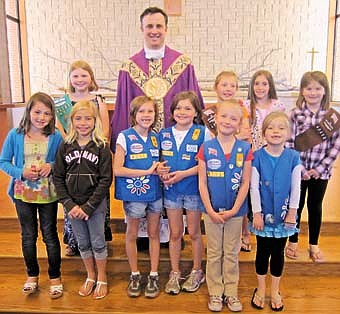 Girl Scout Sunday was recognized on March 18 at St. Bernard's Catholic Church with Father Matt Fasnacht. Pictured, back row from left is Olivia Nicklay, Fr. Matt Fasnacht, Bryttin Henderson, Alyssa Jones, and Elizabeth Root. Front row, from left is Ava Higgins, Elise Rediske, Emily Lamb, Erica Lamb, Abigail Parry, and Lacy Jewson.  