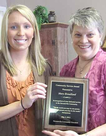 Mary Brouillard received the Community Education Advisory Council's Community Service Recognition Award for 2012 at a breakfast at Tarsilla's on Saturday, May 5. Here, Brouillard poses with her award with Hailey Johnson at left.  