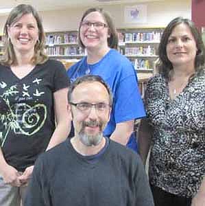 Clockwise from front, are Gary Kadansky, SUE's Friend of Education; Heidi Howe, Teacher of the Year, grades K-5; Becky Holicky, Teacher of the Year, grades 6-12; and Julie Faulhaber, Support Staff Person of the Year.  