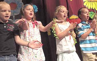 Stewarville Early Childhood held its annual graduation at the Performing Arts Center last Thursday, May 31. Graduates who are singing to celebrate the occasion include, from left, Justice Deno, TeaSue Odegaard-Burzette, Cassidy Anderson and Lincoln Dube.  