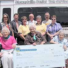 The Stewartville Morning Lions Club has donated $500 in proceeds from its recent baked potato supper to the Stewartville Care Center, which will use the money to purchase gasoline for its van for senior field trips. Front row, from left, are Care Center residents Lucille Laughlin, Shirley Nielsen and Helen Abbott. Standing in back, from left, are Judy Schroeder of the Morning Lions, Gene Gustason, Care Center administrator, Morning Lions members Sharon Moehnke, Clair Mrotek and Kay Tvedt, Myron Wetzel, the driver of the senior citizens van; and Sharon Bernard, activities director at the Care Cen<!--1up-20-->ter. The Morning Lions Club took over the baked potato supper from the Stewartville Lioness Club, which traditionally donated the proceeds to the Care Center. 