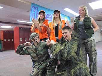 Stewartville High School students who celebrated homecoming by dressing for Fairy Tale Camouflage Blaze Orange Day on Tuesday, Sept. 18 include, front row, from left, Kyle Bartelt and Derek Krenke. Back row, from left, Nicole Hoffman, Amanda Bauman and Brittanie Hoerner.  