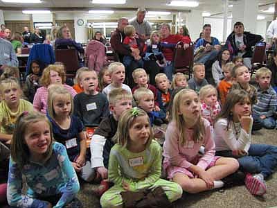 Many Wee Care students were fascinated by the reptiles and amphibians from the Reptile & Amphibian Discovery (RAD) Zoo of Owatonna at St. John's Lutheran Church last Monday, Oct. 8. Melissa Pastika, owner of the RAD Zoo, below, displayed several interesting animals.     