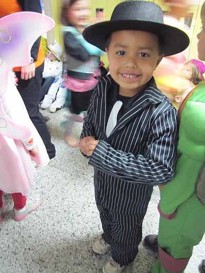 kindergartner Jamal Aden dresses as a gangster