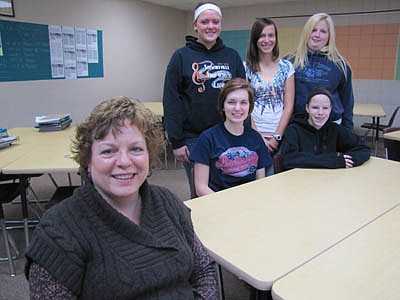 Susan Grant, a social studies teacher at Stewartville High School, left, has earned the Thrivent Financial Personal Finance Educator Award for starting a program at SHS called "Kids Teaching Kids About Personal Finance."  Among the students taking part in this year's program are, front row, from left, Amanda Lound and Riley Paulson. Back row, from left, Alax Oviatt, Madeline Grimm and Rabecca Bredesen.  