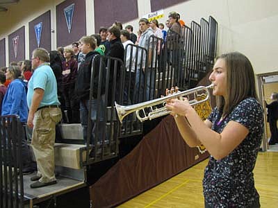Laura Louks, a senior at Stewartville High School, plays taps during the annual Veterans Day ceremony at the SHS gym on Thursday, Nov. 8.   