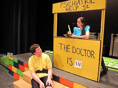 Charlie Brown (Nathan Lange)&#8200;seeks advice from Lucy (Adriana Nelsen-Gross) during a dress rehearsal of the Stewartville School District play, "You're a Good Man Charlie Brown."   