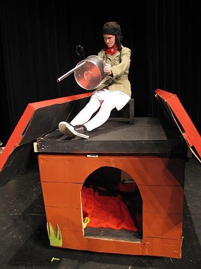 Snoopy (Christina Meline), the World War I flying ace, takes down German aircraft during a dress rehearsal for the Stewartville School District's "You're a Good Man Charlie Brown," which will debut at the Performing Arts Center this Friday, Nov. 16 at 7 p.m.  