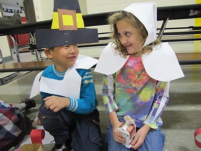 All decked out as pilgrims, Alvin Dong, left, and Ayan DeCook share smiles at the Thanksgiving Feast for first graders at Bonner Elementary School on Tuesday, Nov. 20. See another pho<!--1up-20-->to from the event on Page 16. 