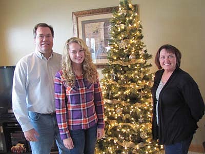Steve and Sheila McNeill, pictured with their daughter Marie, are looking forward to welcoming guests to their home during the Christmas on Display House Tour this Saturday, Dec. 1. "We've never done anything like this before," Sheila said. "It's kind of fun to get into the spirit of the holidays."