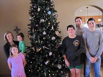 The Higgins family is looking forward to welcoming guests to their home for the Stewartville Area Chamber of Commerce's Christmas on Display House Tour this Saturday, Dec. 1. From left are Michelle, holding Ari, 2; Ava, 8; Aiden, 12; Jason and Alex, 15.  