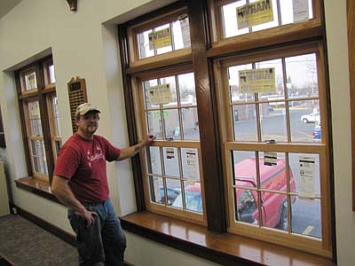 Kevin Johnson of Radcliffe Homes likes the look of the new Marvin windows in the main-floor meeting room at Stewartville City Hall. 