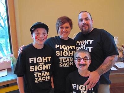 Hundreds of Stewartville and area residents attended a benefit for Zach Wyant, far left, at Riverview Greens Country Club on Saturday, Nov. 24. Also pictured are Angie and Mike Conlin, Zach's parents, and Tarin, 7, Zach's younger brother.  