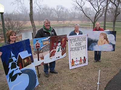 Members of the Stewartville Area Chamber of Commerce WinterFest Committee hold a number of life-sized Christmas cards that were on display at Florence Park for WinterFest on Saturday, Dec. 1. Chamber members include, from left, Lonnie Boe, Mark Podein, Chamber president; Patty Stensrud and Melissa Sue Martin, Chamber administrator.  In next week's issue, the STAR will include the names of the artists who won the People's Choice Award for the life-sized Christmas card contest. 