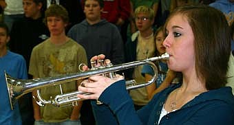 Sara Zent plays taps during the Veterans Day ceremonies at Stewartville High School on Nov. 12.  