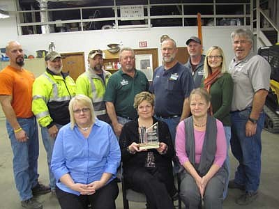 The city of Stewartville won first place in the WinterFest Parade of Lights Contest. City employees who helped with the float include, front row, from left, Laurel Jacobs, Cheryl Roeder and Barb Neubauer. Public works employees in back, from left, include Eric Domino, Dan Harris, Sean Hale, Mark Stevens, Owen Sass and Brian Montgomery. Standing at right are Melissa Sue Martin, administrator of the Stewartville Area Chamber of Commerce, which sponsored the parade; and Mark Podein, Chamber president.