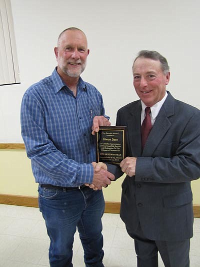 Owen Sass, public works supervisor for the city of Stewartville, left, accepts the Mayor's Award for City Service from Mayor Jimmie-John King at the city's annual awards and recognition event on Wednesday, Dec. 12.