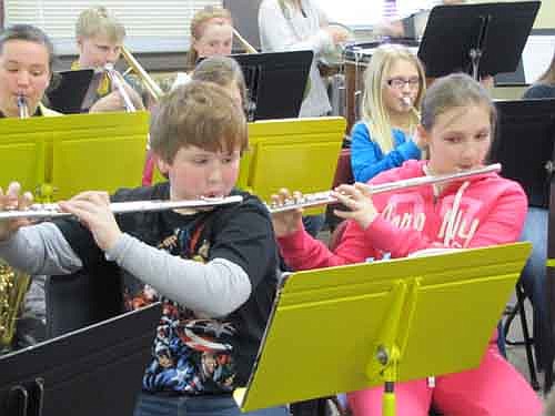 The Stewartville Beginner Band, featuring fifth graders from Central Intermediate School, will present a concert at the Stewartville High School Performing Arts Center this Thursday, Jan. 24 at 7 p.m. The Band will play a number of popular tunes, including "Hot Cross Buns," "Go Tell Aunt Rhody," "Little Robin Redbreast" and "Merrily We Roll Along." Above, Andrew Hoffman, left, and Ireland Broadwater prepare for the concert at a practice session last Friday, Jan. 18.  Carol Bressel is the director of the 63-member Beginner Band. 