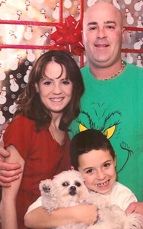 Nicole Jahns, 36, left, who has lived with cystic fibrosis since birth, is awaiting a lung transplant. She is with her husband Paul and son Aidan, 8. 