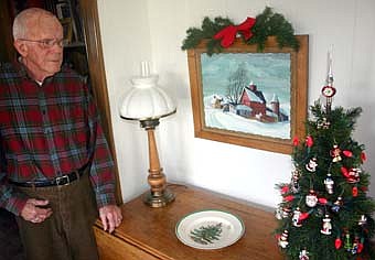 ART IN THE HOME -- The walls of Donald Sullivan's home at 111 Sixth Street Northeast are adorned with a number of paintings by Robert Sullivan, a well-known Simpson artist, including the winter scene shown above. 