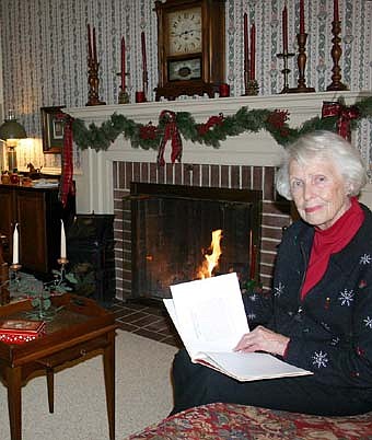 Gerri Gray sits near the fireplace inside the historic Griffin-Gray Funeral Home.  